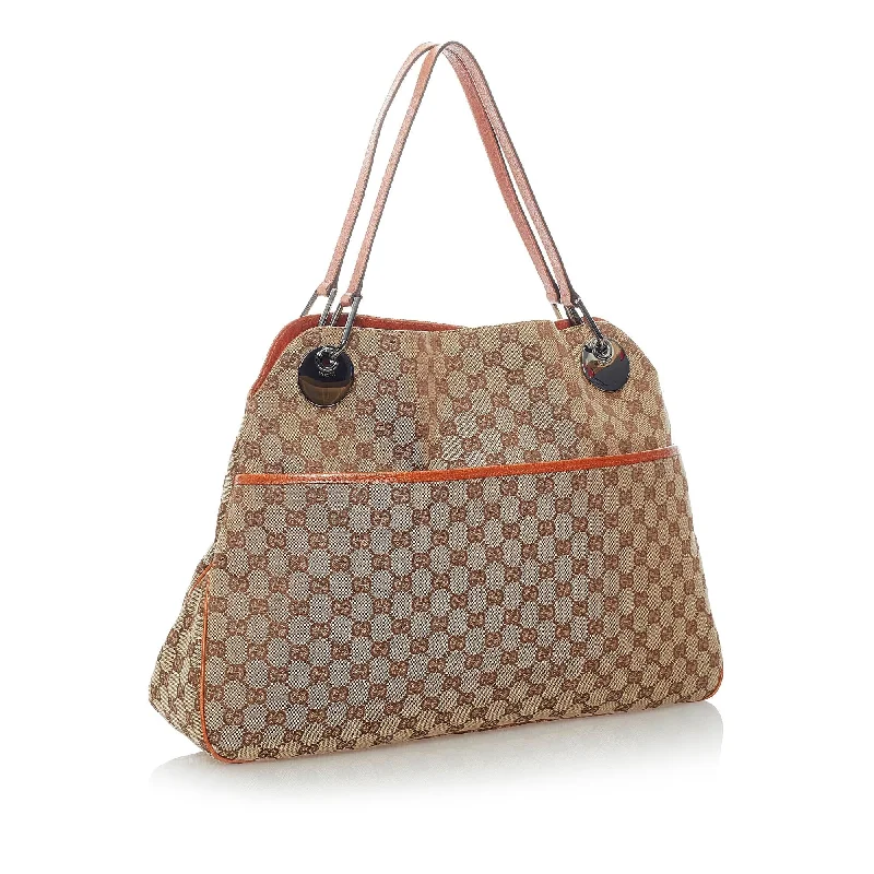 Women Gucci crossbody bags with a woven leather strapGucci GG Canvas Eclipse Shoulder Bag (32048)