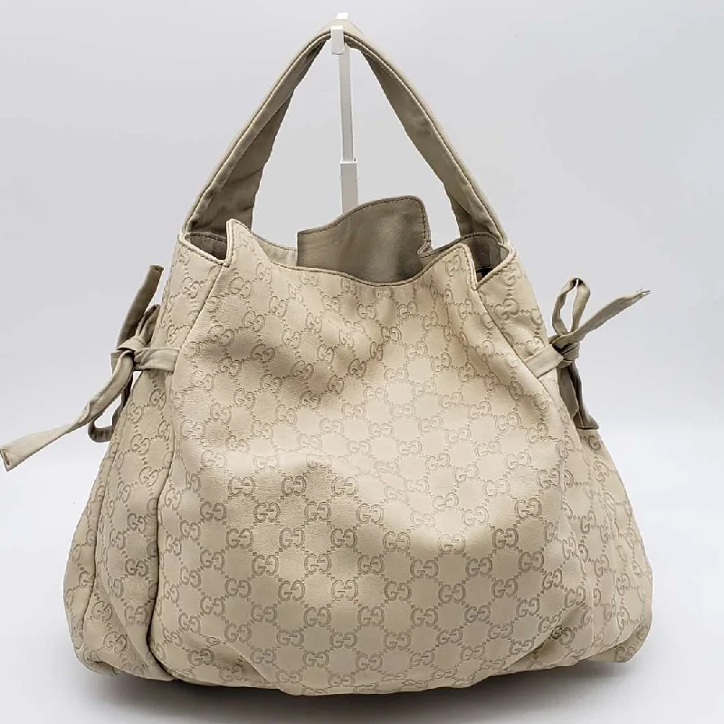 Gucci Marmont bags for women with quilted leather exteriorsGucci Gussissima Cream Shoulder Bag