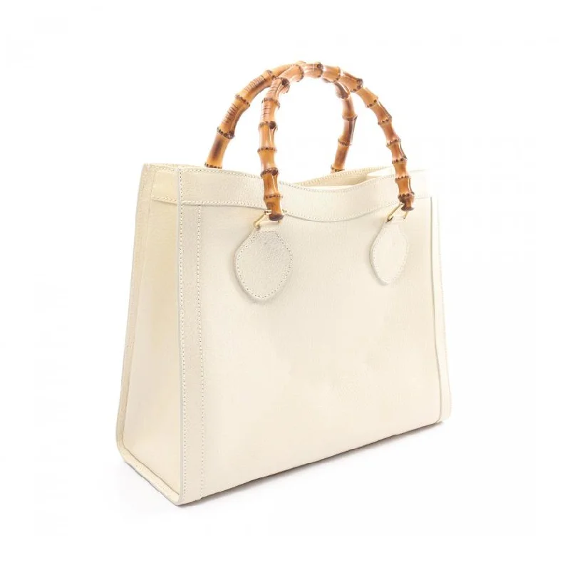 Women Gucci Sylvie bags featuring the signature web stripeGucci Bamboo Leather HandBag Ivory