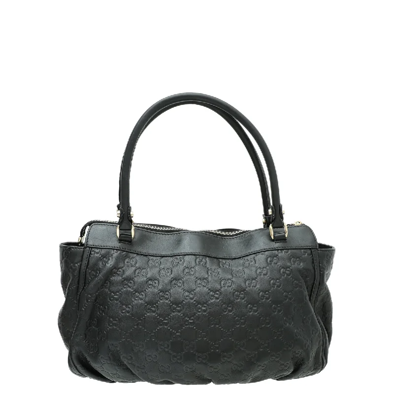 Women Gucci Sylvie bags featuring the signature web stripeGucci Black Guccissima D Ring Tote Bag