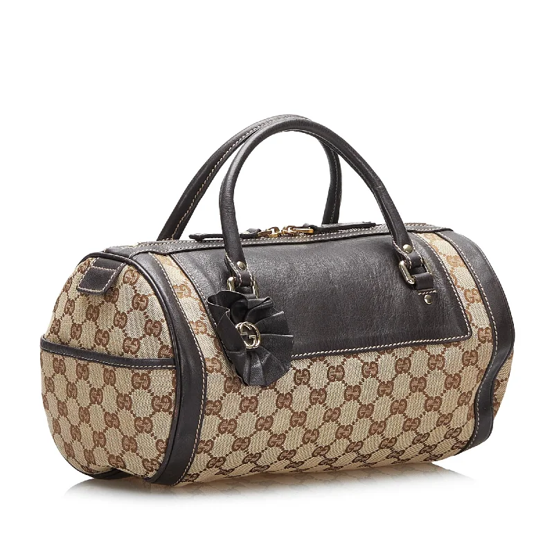 Women Gucci Sylvie bags with a monogram - embossed leatherGucci GG Canvas Trophy Handbag (SHG-4YAF0E)