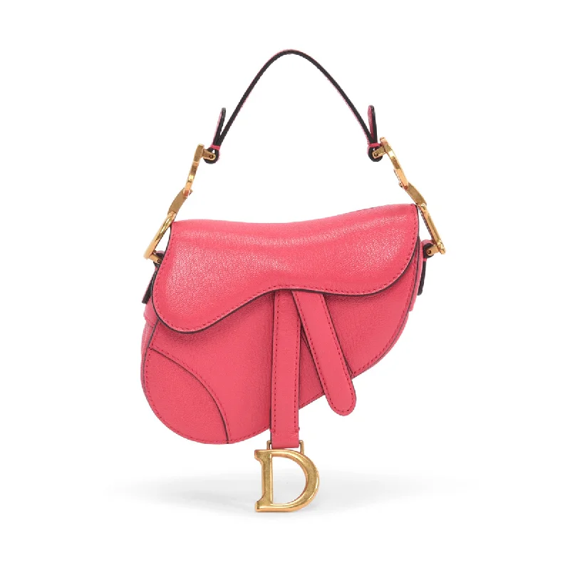 Christian Dior Saddle bags with a studded trim for a bold lookDior Fuchsia Goatskin Micro Saddle Bag