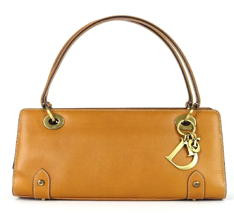 Christian Dior handbags with a snap - button closure and a decorative buckleEast West Calf Leather Handbag